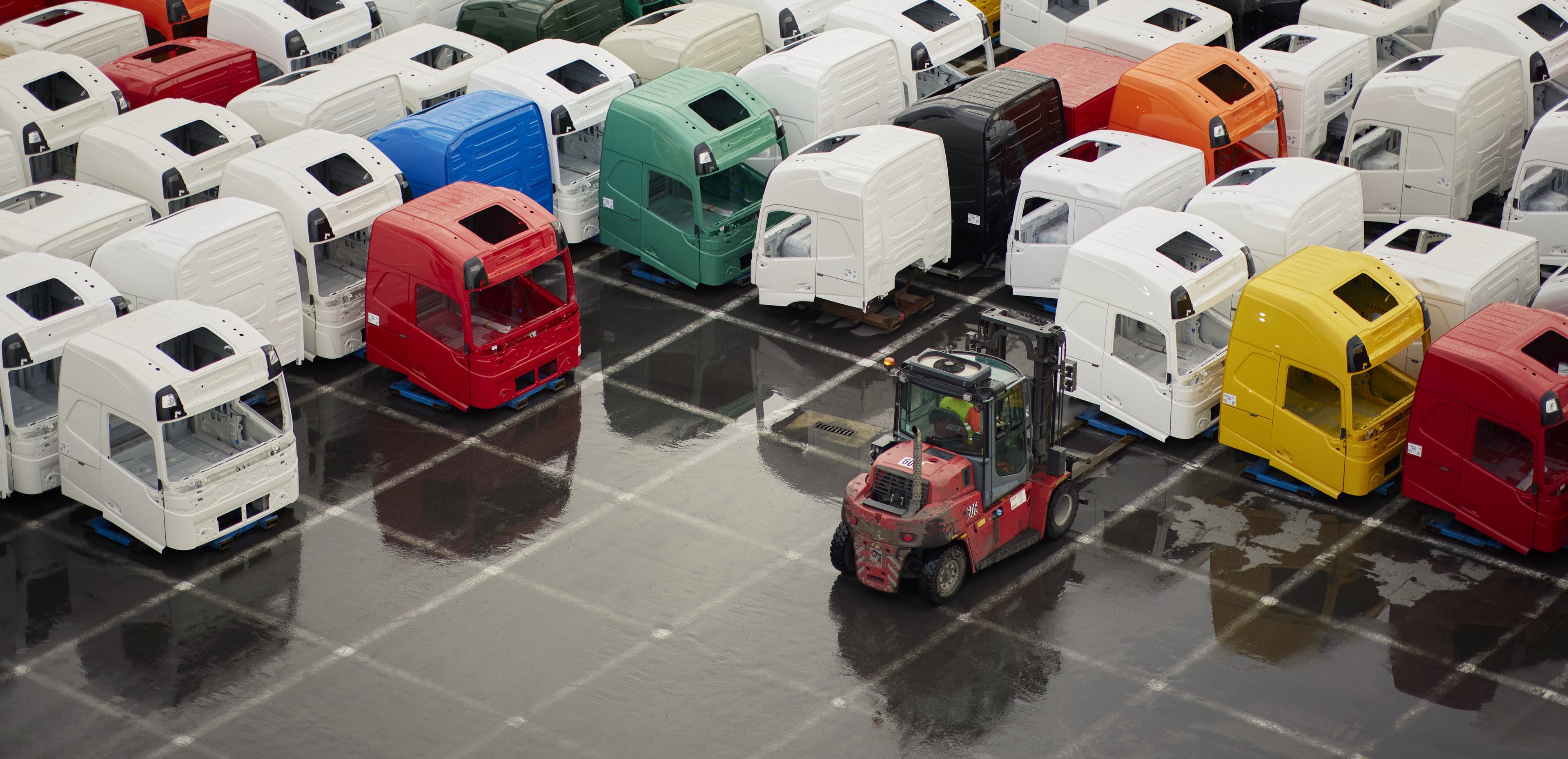Truck houses in parking lot in different colors