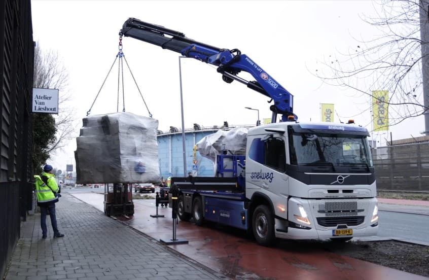 Crane assisted loading of the Monkey Rock Statue.