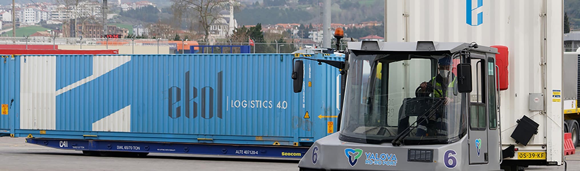 Terminal worker driving a tugmaster to move a container around the Yalova terminal in Türkiye