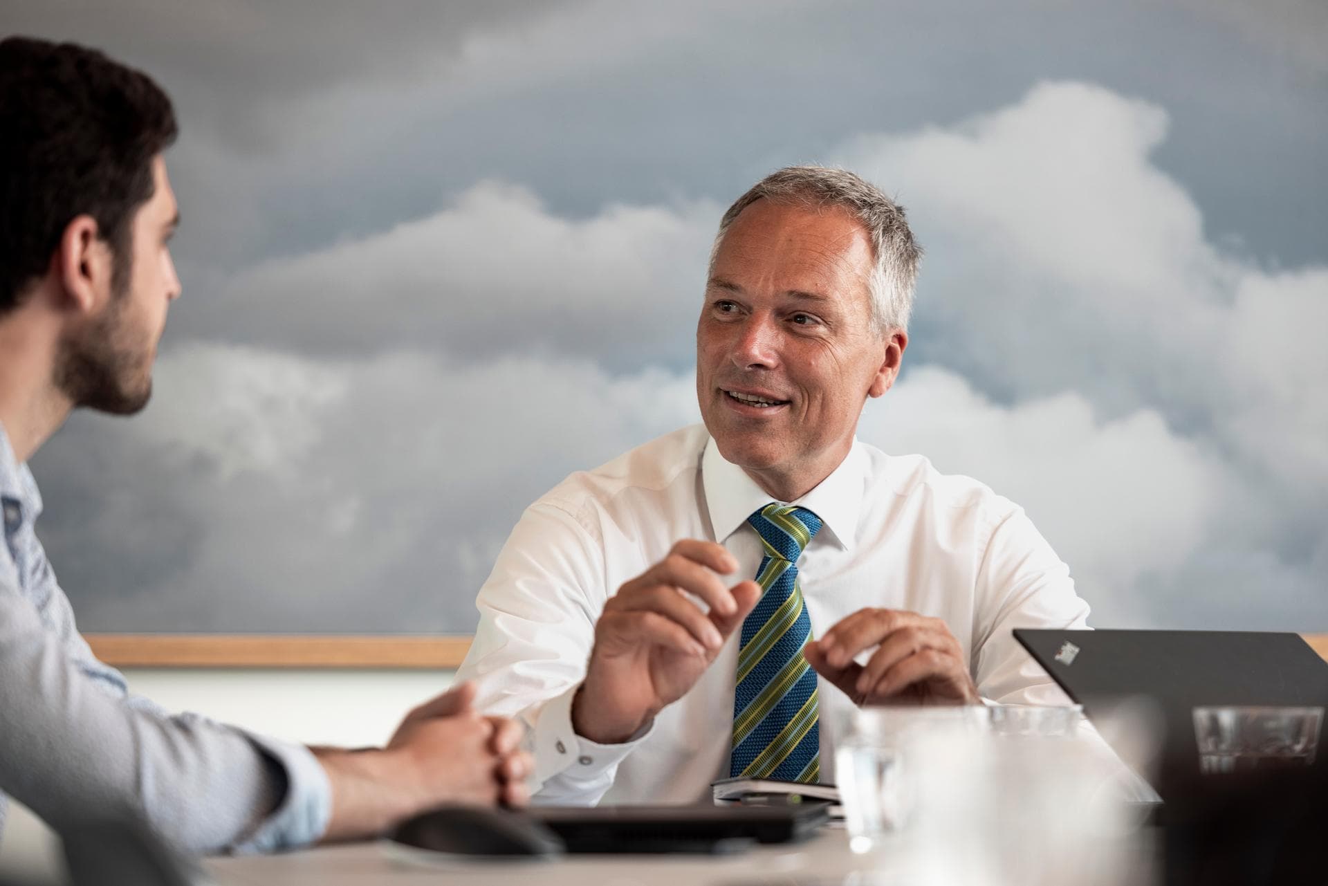 Two office workers debating at a table