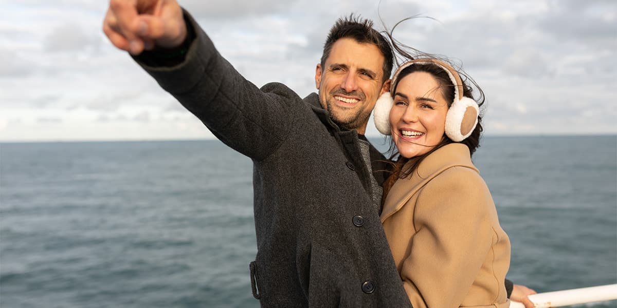 Couple on deck of DFDS ferry at sunset