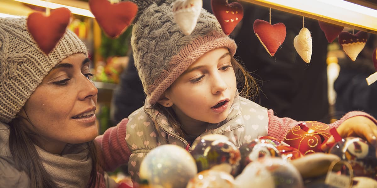 Mother and daughter looking at baubles