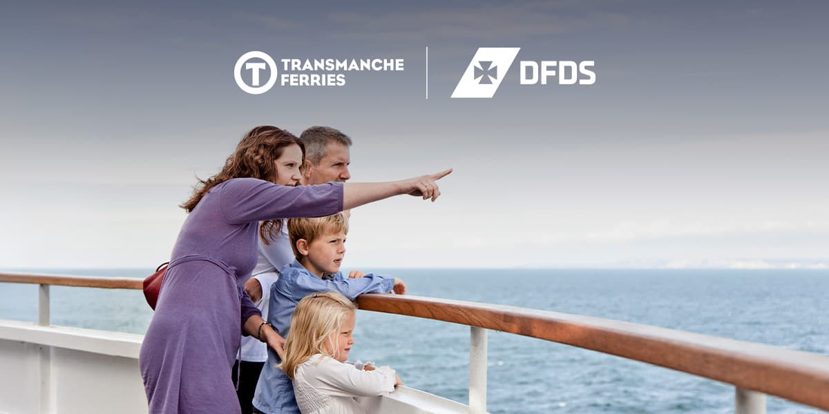 Woman pointing at something in the distance with her family on the deck of the DFDS ferry
