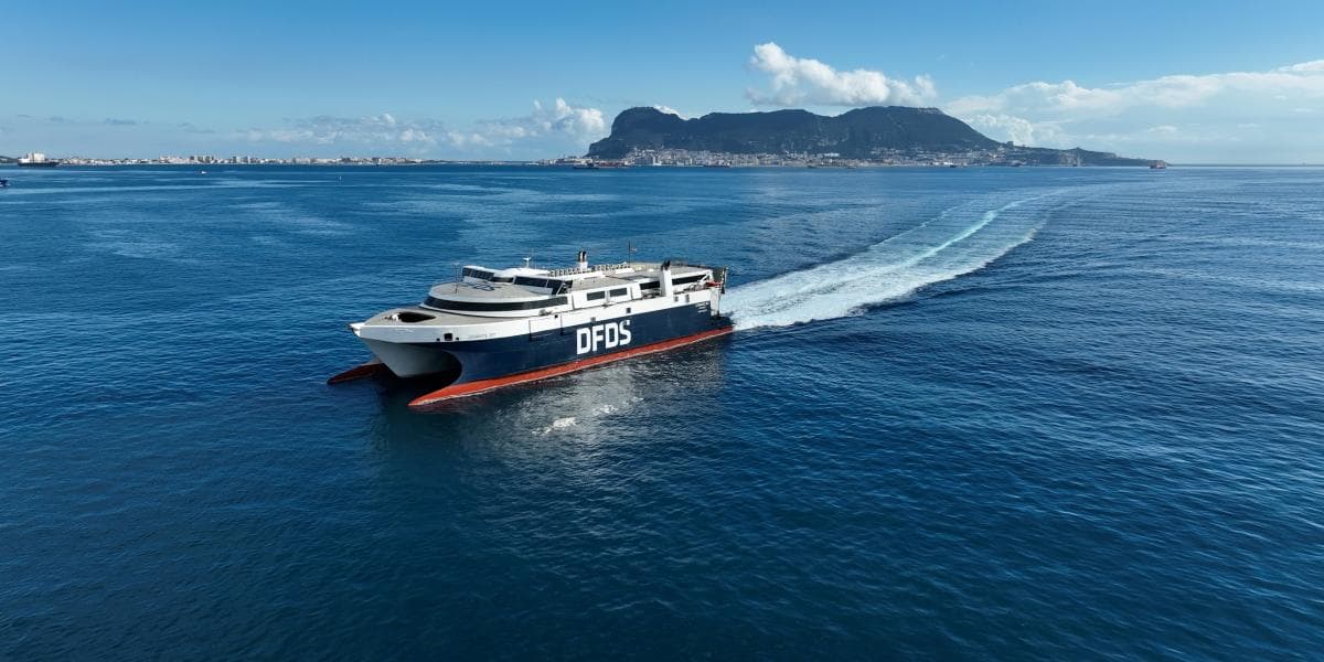 DFDS vessel Levante on the open sea, with the mainland in the background