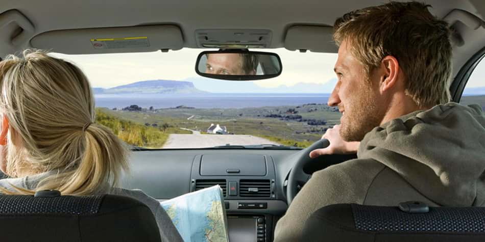 Couple in car travelling in Scotland