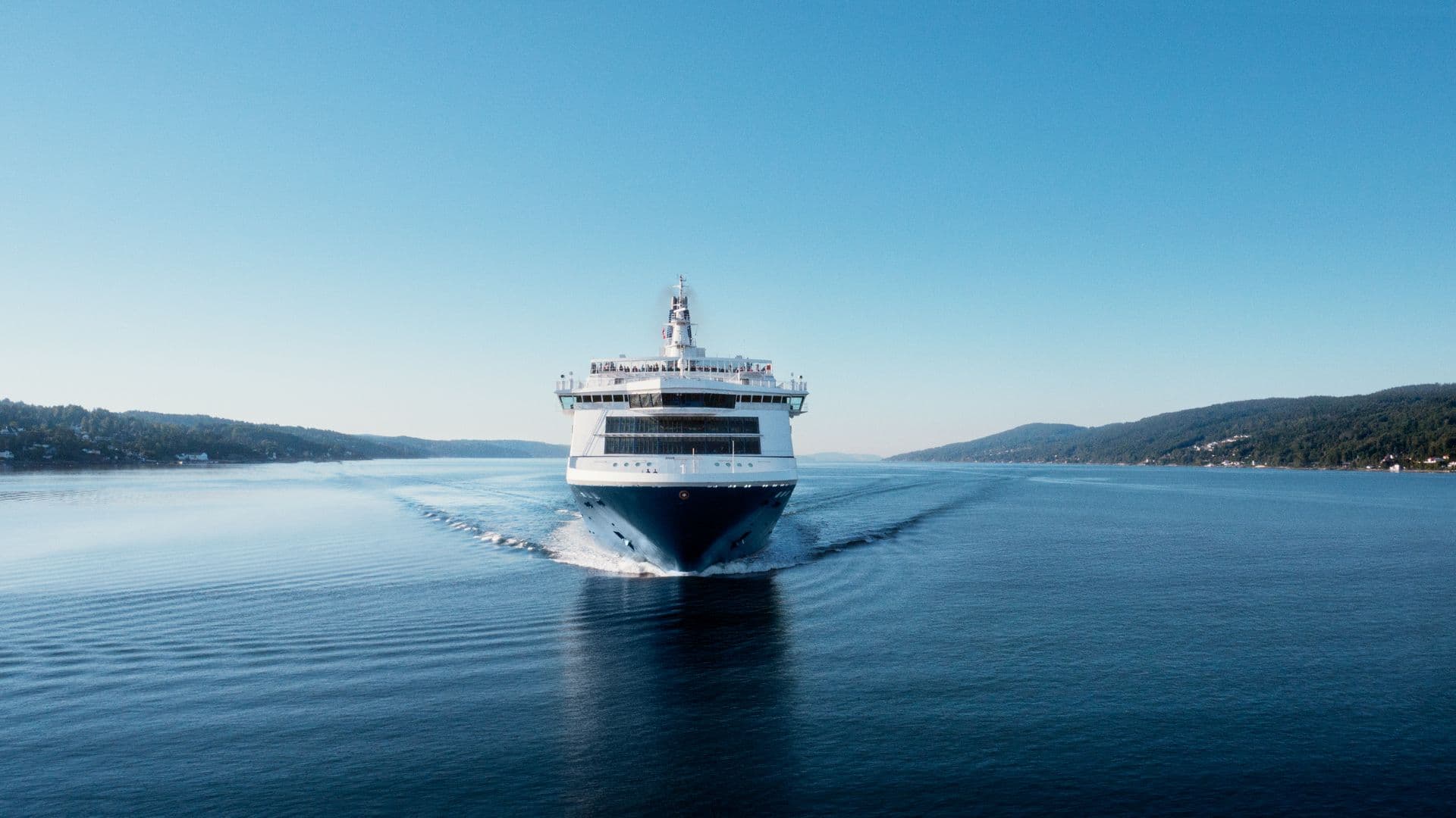 Vessel of the OFC route, photographed from the front, sailing through the fjord of Oslo/N