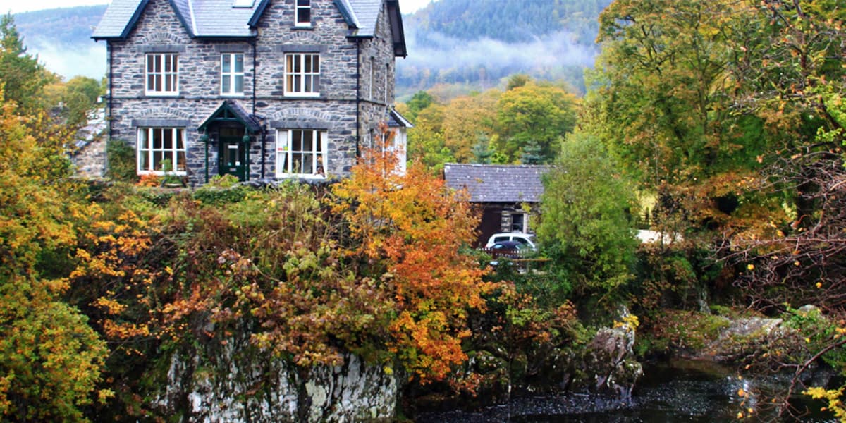 House with natural autumn colours betws and coed