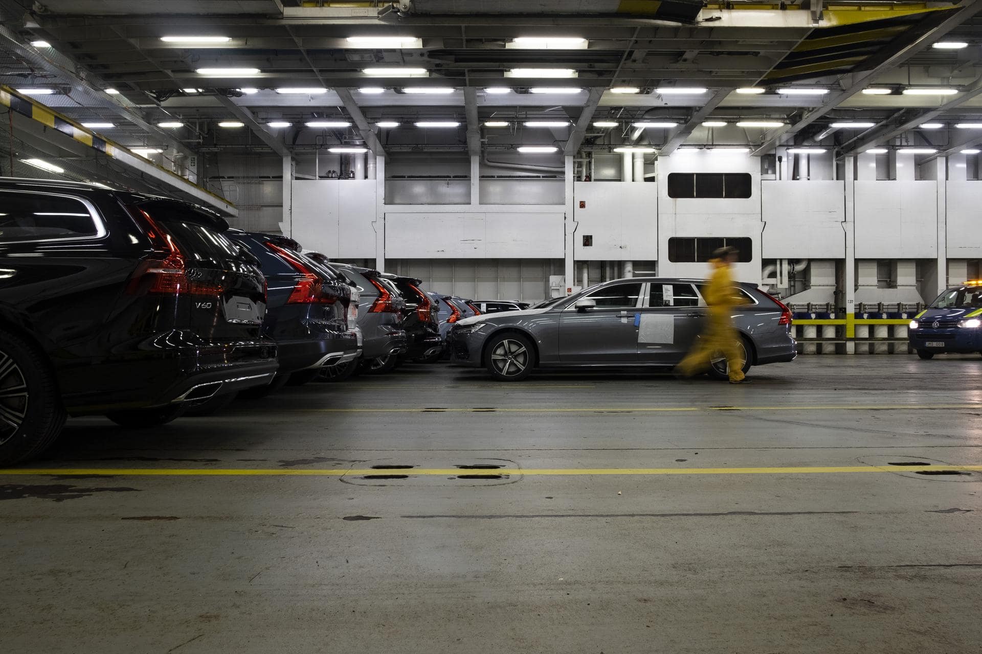 Photo of parked cars with a blurred man running past for DFDS automotive