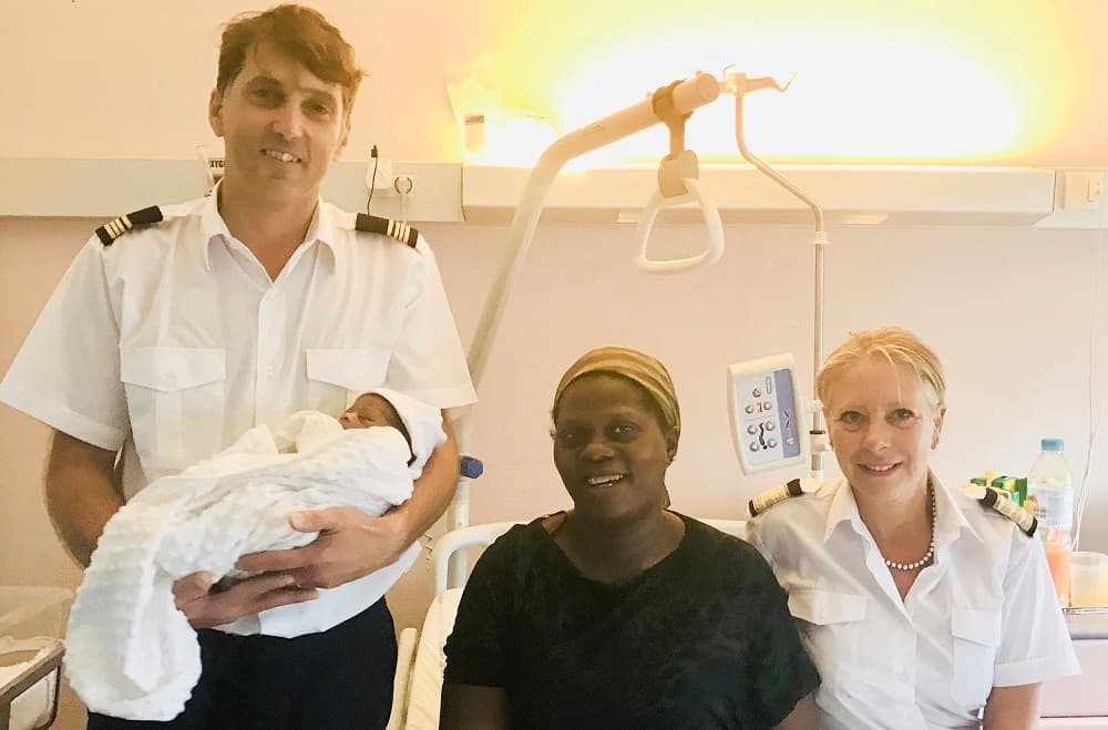 Captain, first mate, and mother with baby born on board DFDS vessel