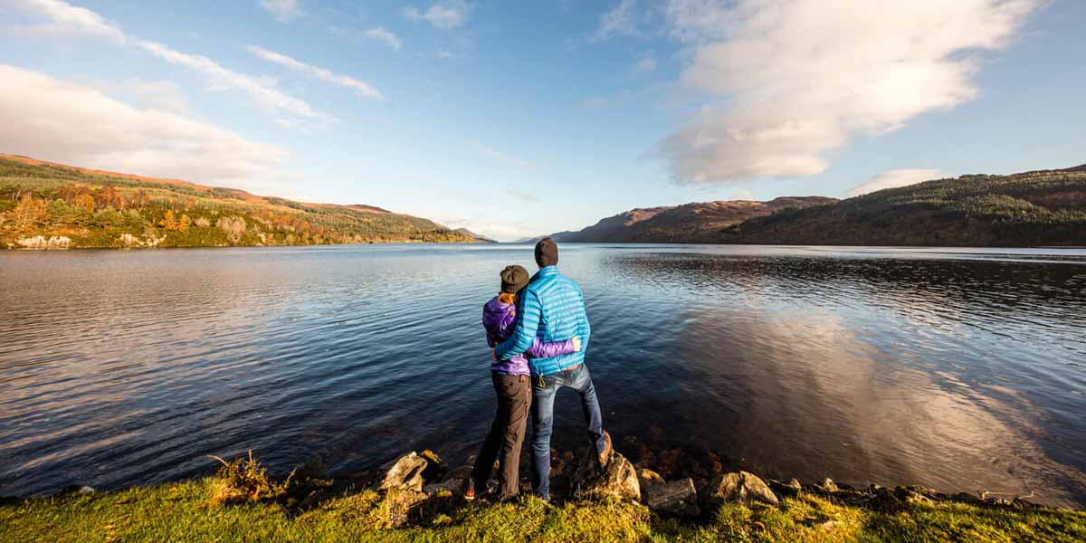 Couple looking over Loch Ness, Scotland