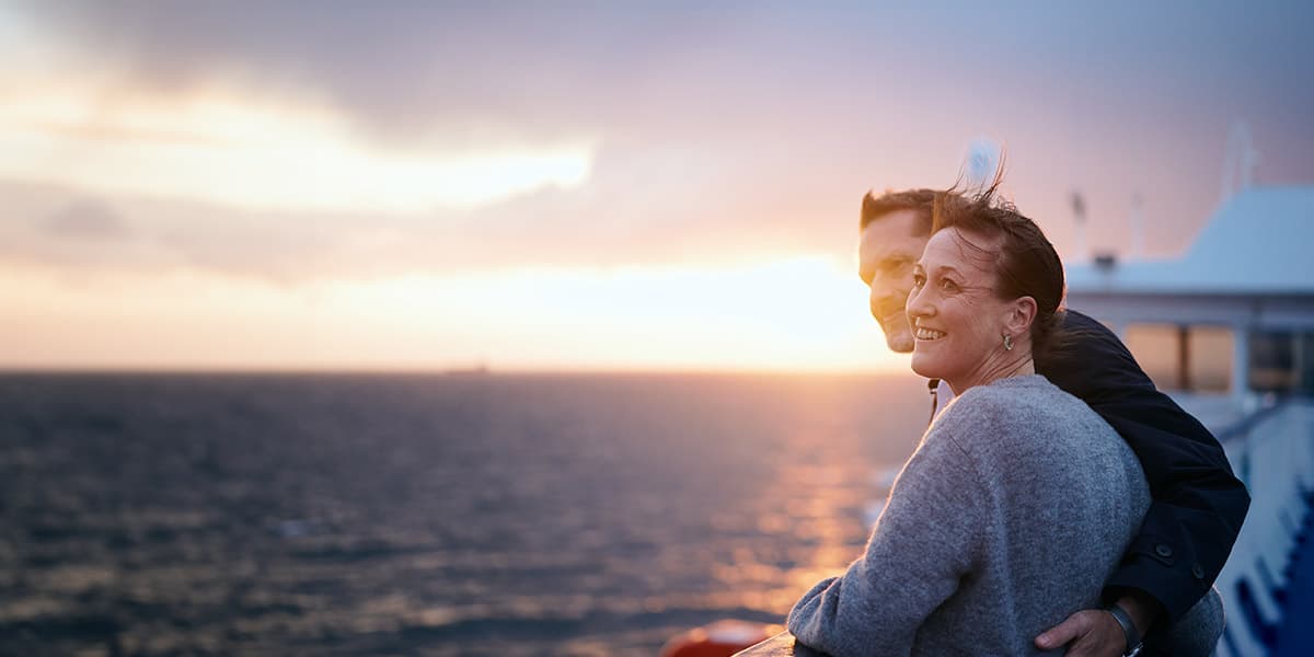 Couple onboard DFDS ferry watching the sunset