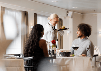Couple enjoying a meal HERO