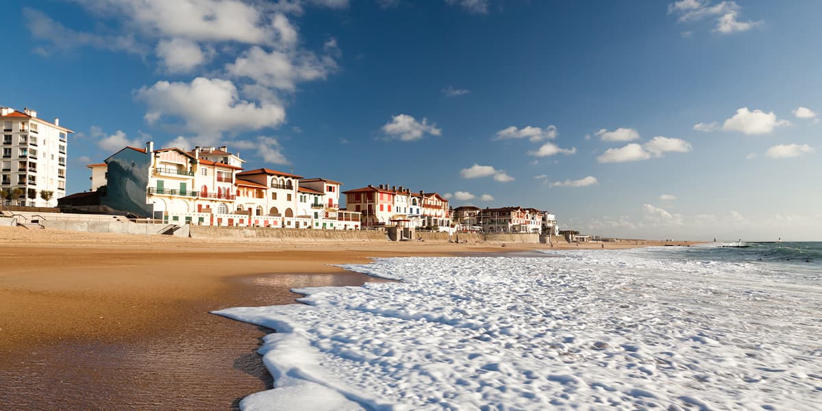 Beach with houses overlooking the sea